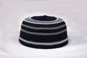 Navy and gray striped knitted hat on a white background
